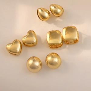 Detailed close-up of 18k gold-plated stainless steel earrings in geometric shapes