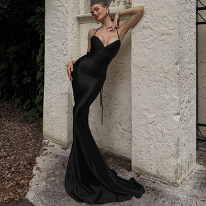 Elegant backless black satin evening dress with thin straps and sleek mermaid cut design