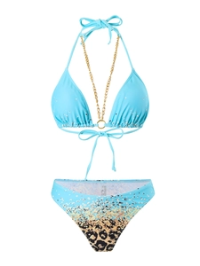 Close-up of golden metal ring and chain detail on leopard print mesh bikini top