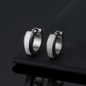 Classic silver and black titanium steel hoop earrings with a brushed metal texture