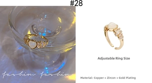 Detailed macro view of an adjustable heart-shaped zircon ring with gold plating