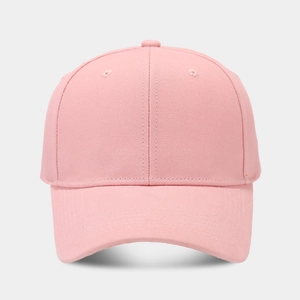 Front detail of solid pink cotton twill baseball cap with curved brim and eyelets