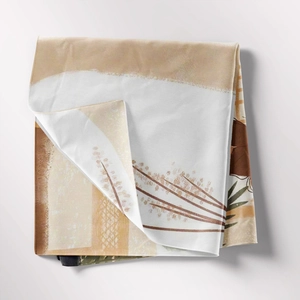Detail of bohemian tapestry fabric showing soft texture and neutral botanical print
