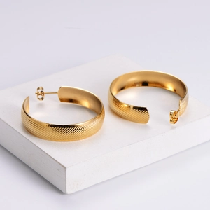 18k gold plated stainless steel hoop earrings with textured geometric C-shape pattern