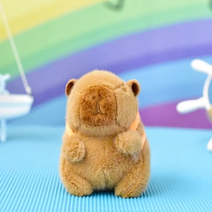 Close-up view of a cute brown capybara plush charm keychain with soft fur texture details