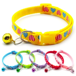 Detailed view of colorful Christmas pet collars with snowflakes and metal bells