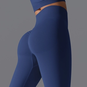 Close-up of seamless dark blue yoga pants showing peach lift and ribbed waistband