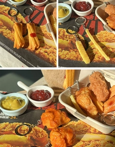 Detailed macro view of realistic PVC fried chicken and french fries keychain models