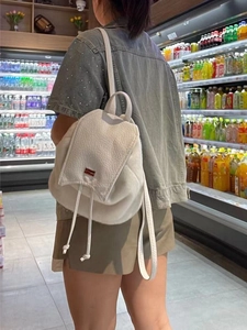 White fluffy mini backpack for women, cute plush fuzzy schoolbag with drawstring closure.
