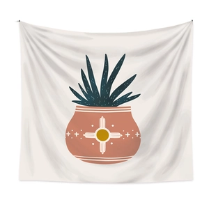 Detail of bohemian tapestry featuring a sun pattern pot and green succulent plant