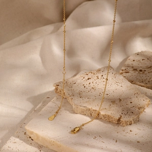 Minimalist S925 sterling silver beaded chain necklace with elegant gold finish on stone