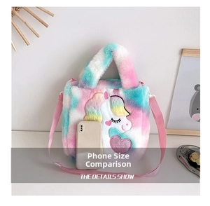 Unicorn plush crossbody bag size comparison with a phone on a white background