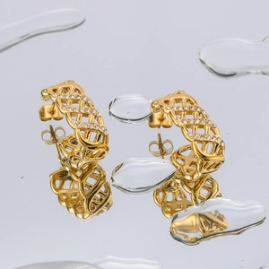 Golden titanium steel lattice earrings with sparkling crystals and water droplet reflections
