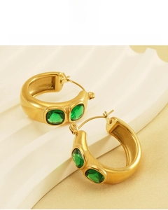 Detail of 18K gold plated earrings with green gemstones and lead-free material info