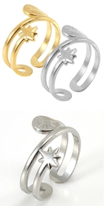 Detail of adjustable double-layer ring with star and textured disc in gold and silver