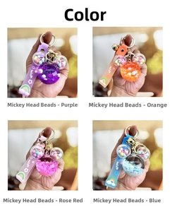 Mickey-shaped liquid sand keychains in four colors with rainbow straps and metal hooks
