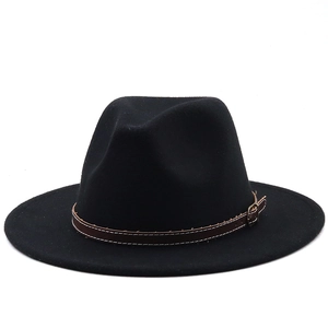 Detail of classic black wool fedora featuring brown leather band with metal buckle