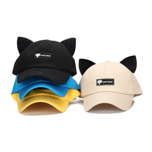 Baseball cap with cat ears and pilot glasses style featuring a Hand Made label