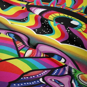 Macro shot of psychedelic rainbow tapestry fabric featuring abstract eye patterns and texture