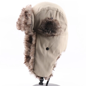 Detail of khaki trapper hat with thick faux fur lining and black side release buckle