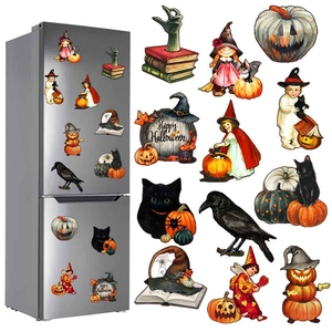 Macro view of retro Halloween magnets with witch and pumpkin on silver fridge