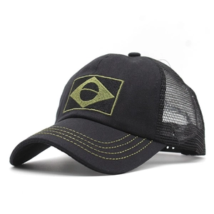 Close-up of Brazilian flag embroidery and yellow stitching on black mesh trucker cap