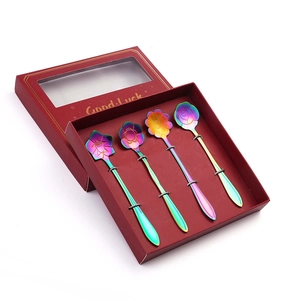 Set of four colorful flower-shaped stainless steel coffee spoons in a red gift box