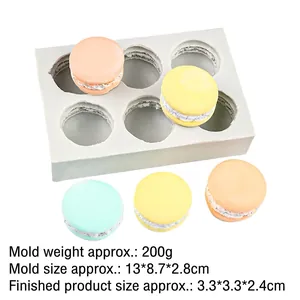 Detailed macro view of 6-cavity silicone macaron mold with realistic textured resin samples