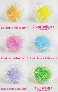 Macro detail of 6cm colorful crinkle pom-pom cat toys with shimmering iridescent tinsel
