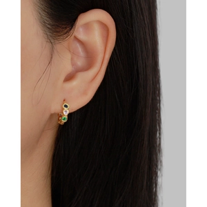 Detailed macro view of S925 silver hoop earrings with vibrant colorful zircon gemstones