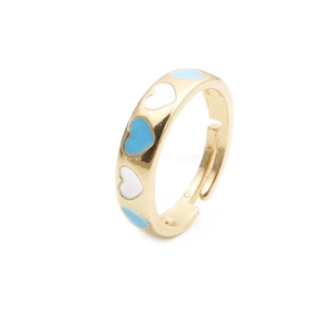 Macro detail of gold-plated open ring with blue and white enamel hearts in contrast