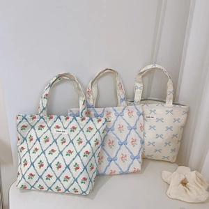 Floral canvas tote bags with blue and red rose patterns in French country style