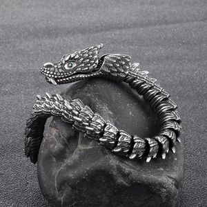 Retro stainless steel dragon bone bracelet for men with green gemstone eyes on black rock