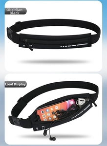 Detail view of black running waist pack with headphone port and reflective strip detail
