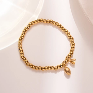 Chic gold beaded bracelet with dual tulip pendants and elastic band for women
