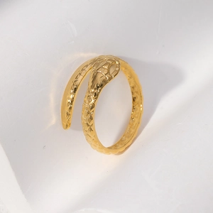 Detailed close-up of golden snake ring showing intricate metallic scale texture and finish