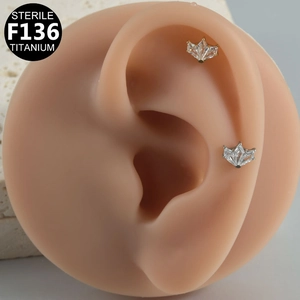 F136 Titanium sterile labret studs with zircon inlays shown on ear models