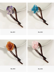Detail view of acetate rose hair clips in four elegant tortoiseshell color variants