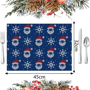 Detail of blue Christmas placemat with Santa Claus and snowflake prints, 45x32cm size