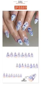 Detail of blue and white almond press-on nails with 3D embossed floral patterns
