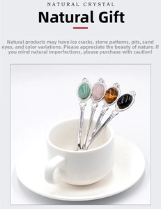 Macro detail of retro silver spoons featuring natural crystal and tiger eye stone inlay