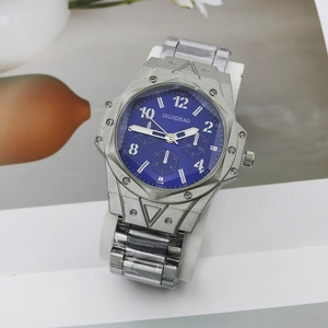 Detail of blue dial quartz watch with three-eye decor and silver stainless steel strap