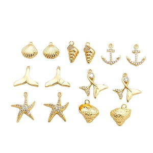Set of 12 gold plated sea charms including shells, starfish and anchors for jewelry