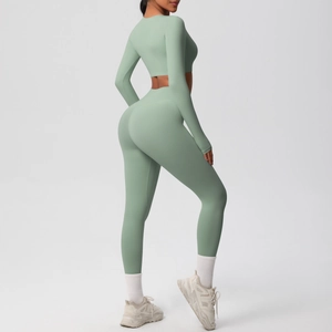 Side view of slim-fit long sleeve yoga top and high-waist leggings in sage green