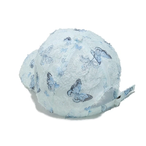 Detail of light blue fuzzy baseball cap with butterfly print and adjustable metal buckle