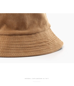 Close-up of brown corduroy bucket hat showing texture and detailed brim stitching