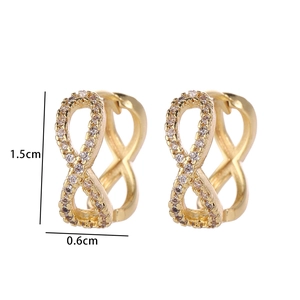Detailed view of infinity-shaped gold earrings with white zircon, size 1.5cm by 0.6cm