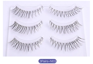 Three pairs of natural wispy false eyelashes on a transparent tray, model N03