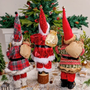 Three 18-inch standing Santa Claus dolls in red, gray, and gold holiday outfits