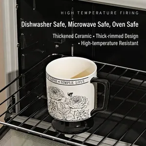 Vintage ceramic coffee mug with black rose print and Simple Love text on oven rack